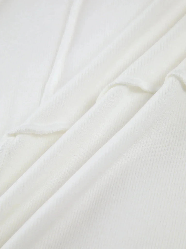 Women's Ribbed Top with Long Sleeves and Detailed Stitching