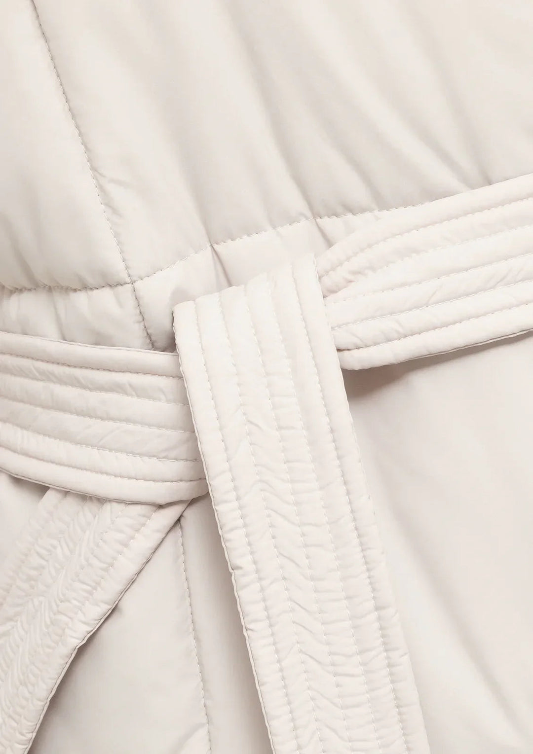 Women's Belted Puffer Jacket with High Collar and Quilted Design